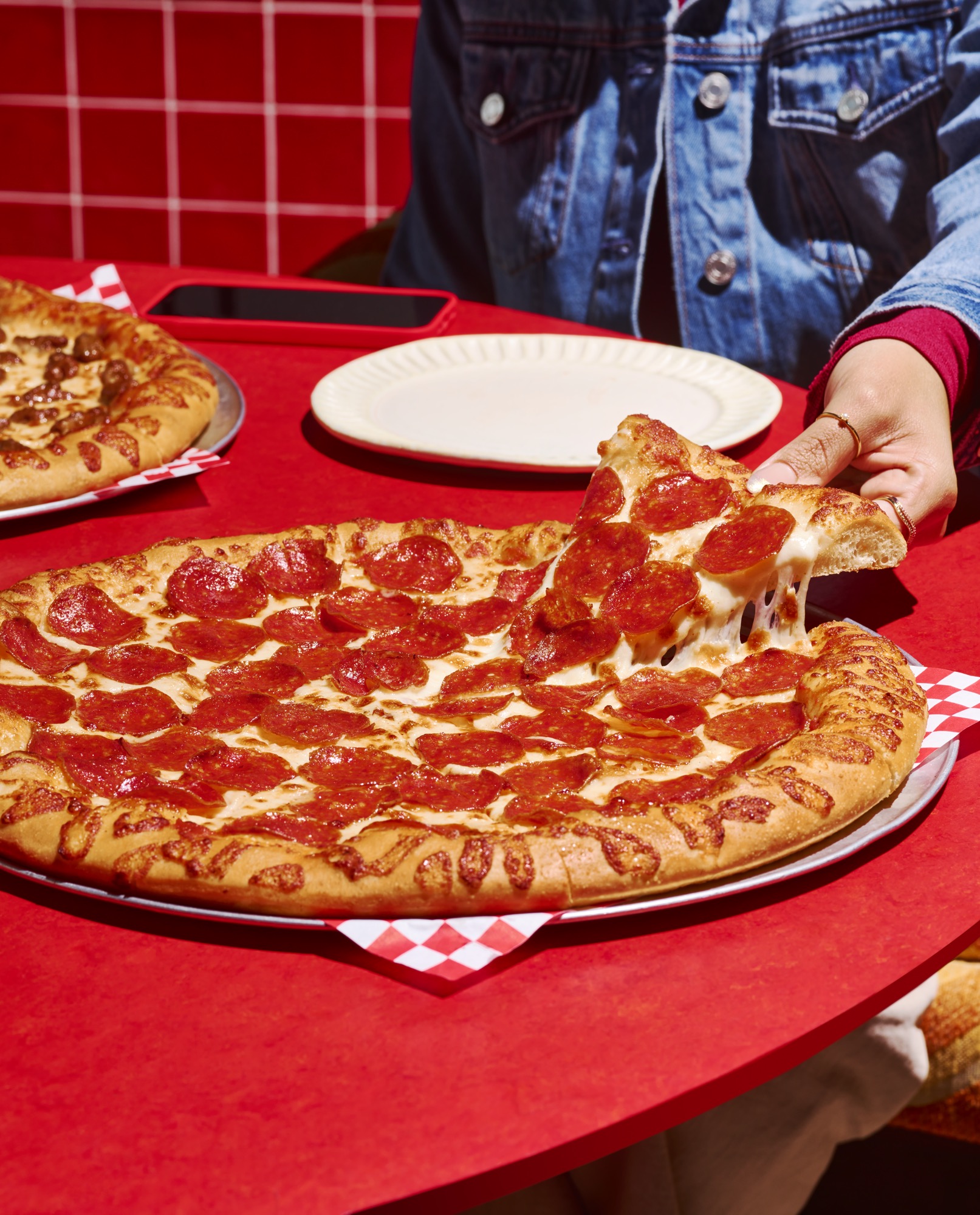 Pizza Hut pepperoni pizza with cheese pull